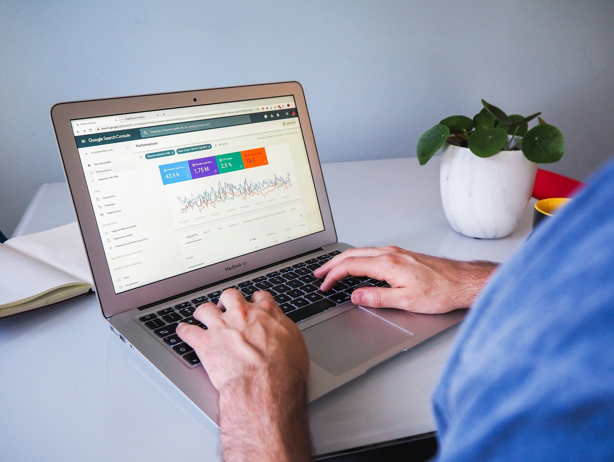 Two colleagues reviewing search performance data together