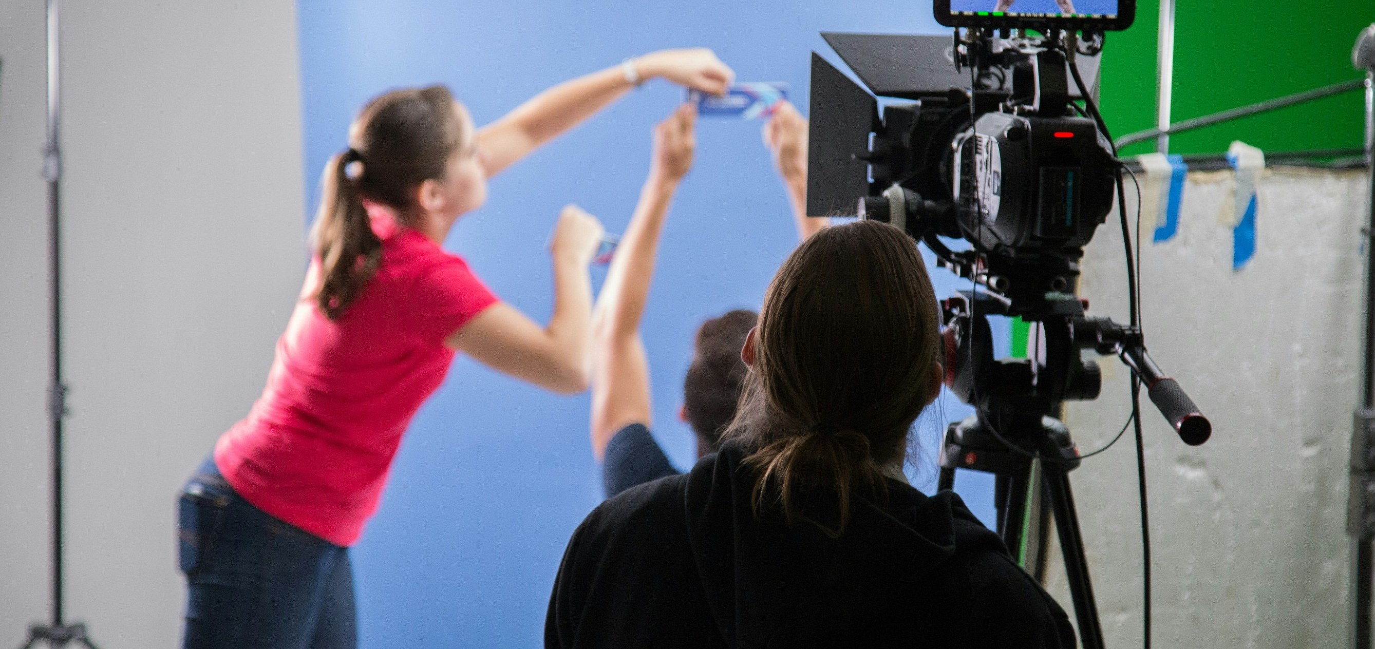 Film crew and creative team setting up a camera on an ad production shoot