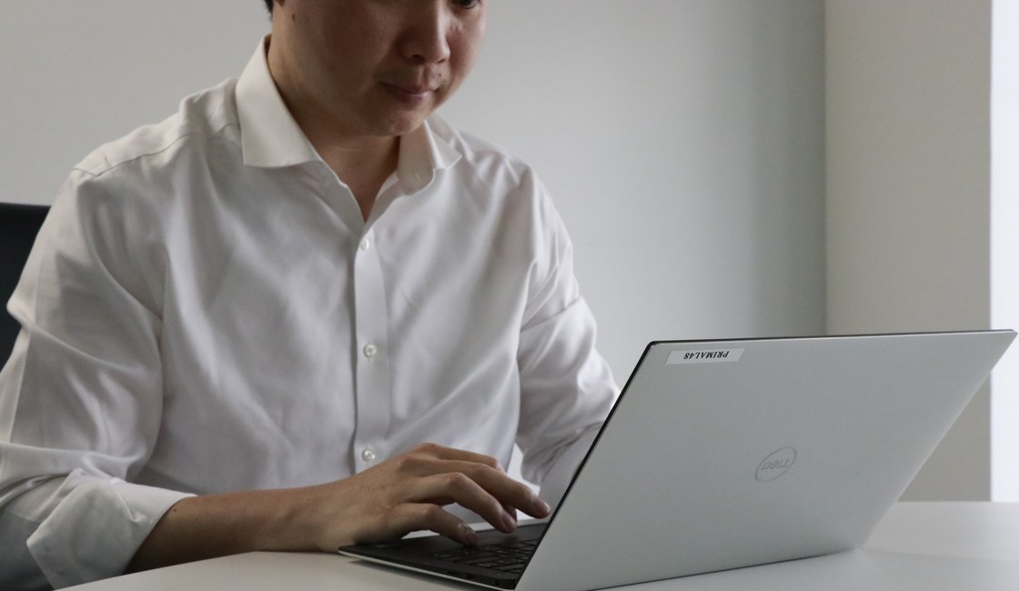 A manager reviewing a campaign report on a laptop