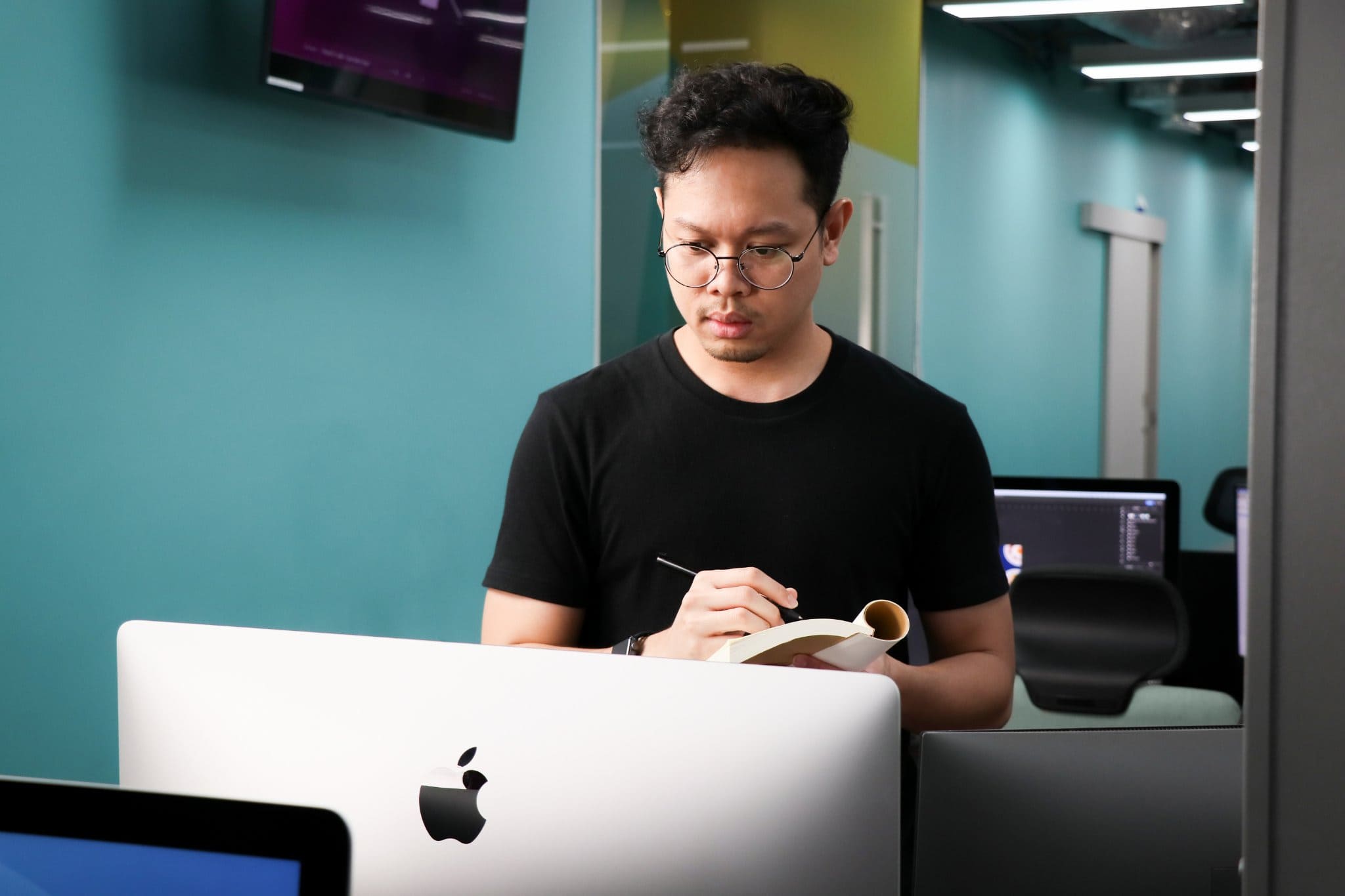 A Primal creative working at his desk