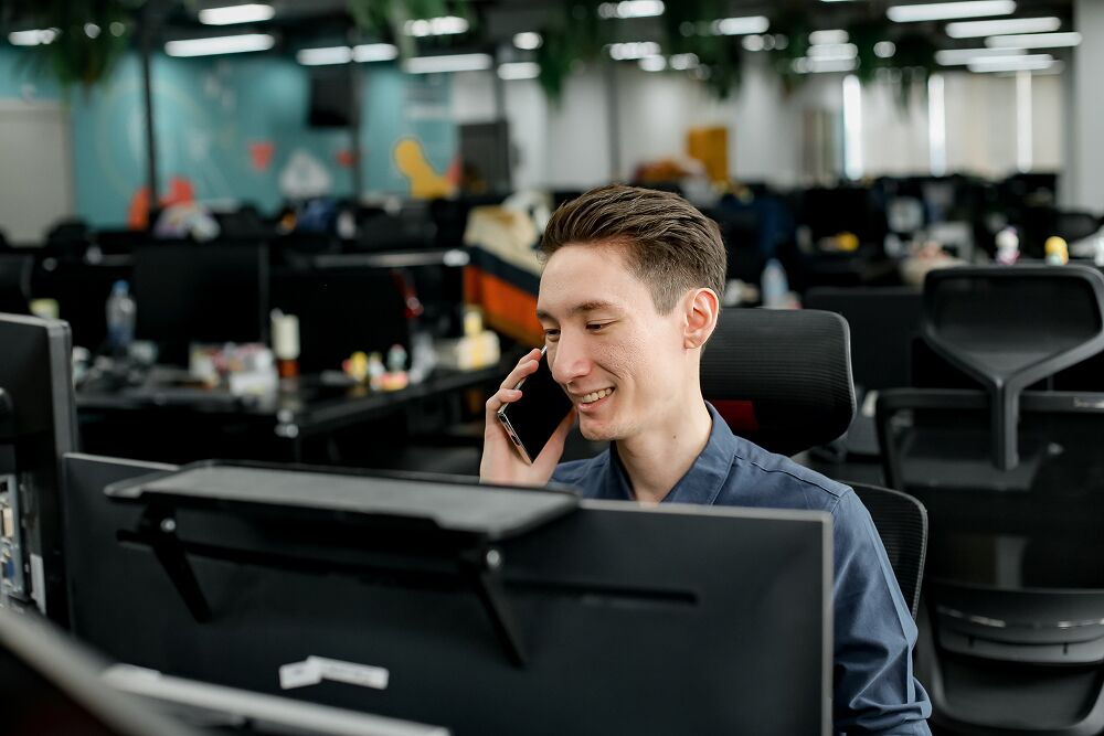 A Primal team member on a call at his desk